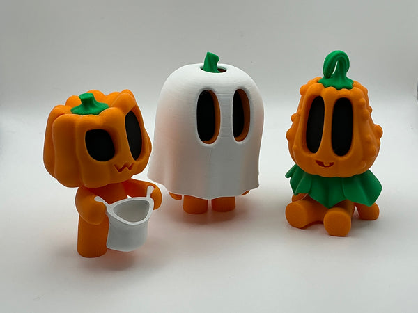 Trick or treat pumpkin figurines
