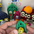 Small green gothic arch clicker with a single yellow birdcage keycap
