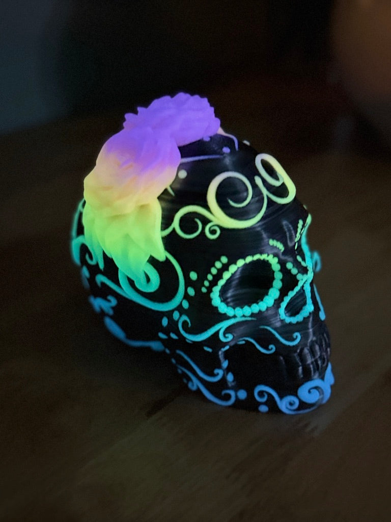 Rainbow floral details glowing on the skull after UV charging