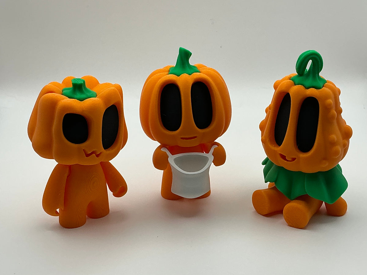 Trick or treat pumpkin figurines