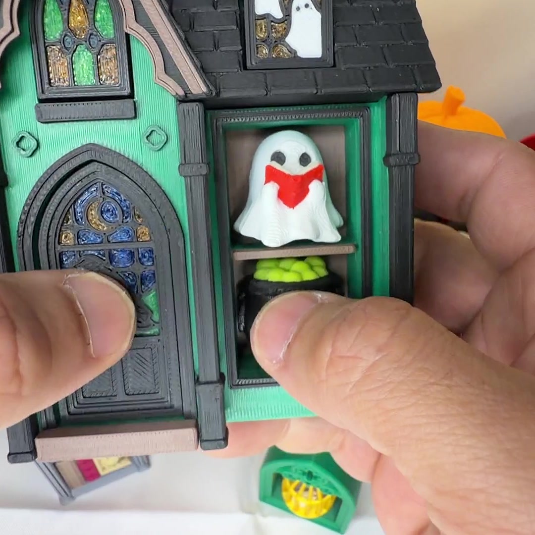 Haunted house clicker shelf with stained-glass windows and a ghost keycap